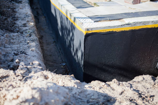 Professional Basement Waterproofing technician working in Manchester, OH